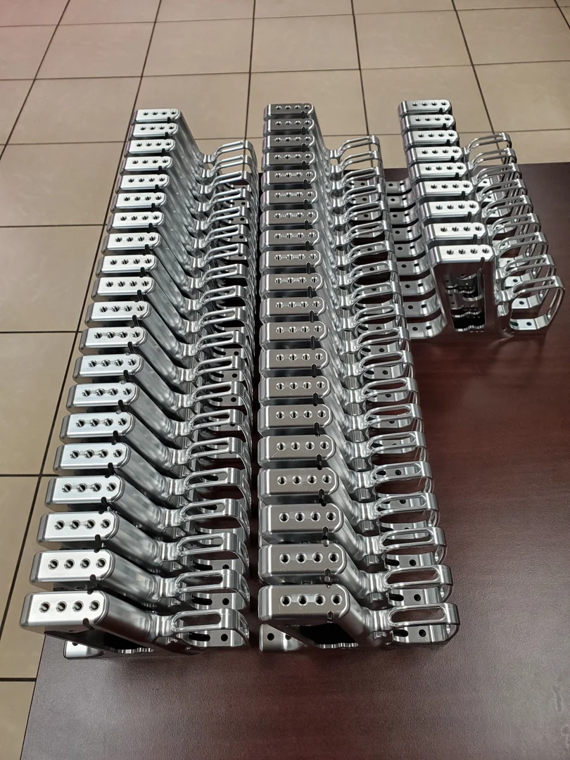 A collection of high-precision machined industrial components showcasing tight tolerances and complex geometries A collection of high-precision machined industrial components showcasing tight tolerances and complex geometries
