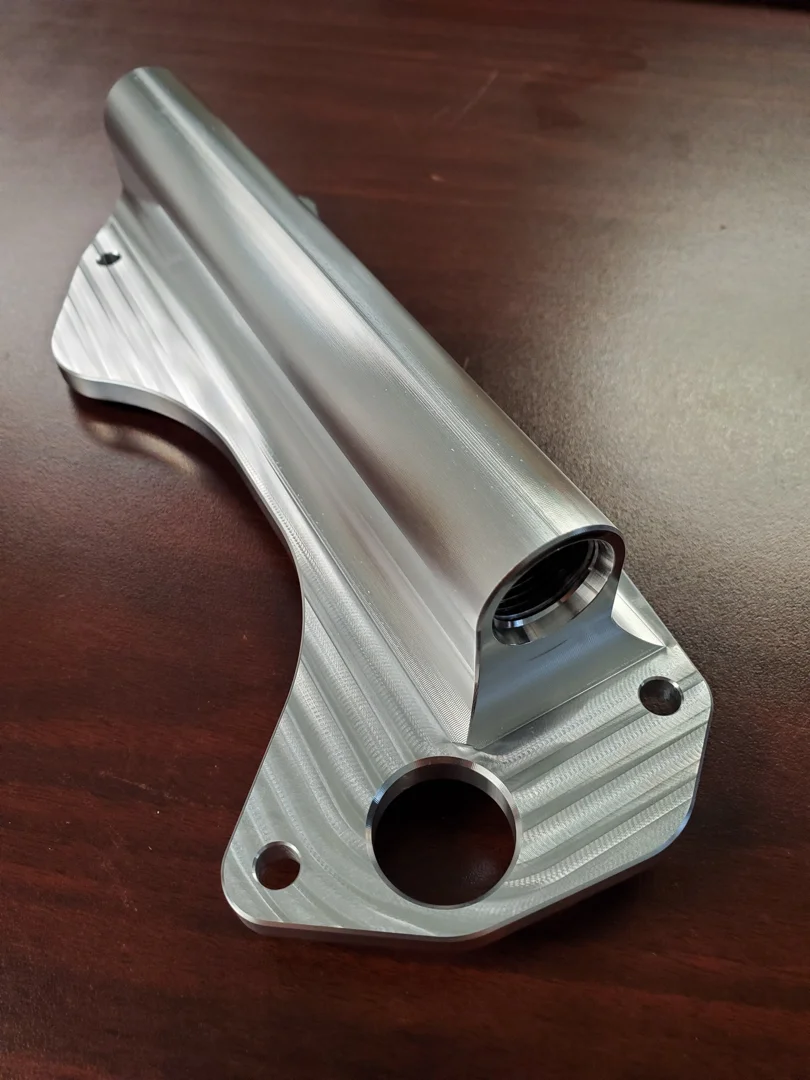 Medical implants and aerospace brackets manufactured with multi-axis precision