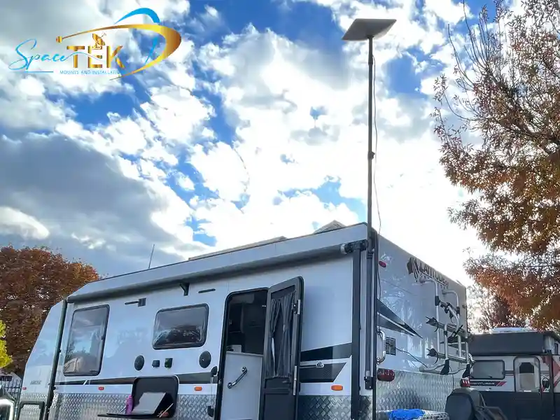 SpaceTek heavy-duty roof mount installed on a caravan in a sunny, rugged Australian landscape, highlighting its robust construction and secure attachment SpaceTek heavy-duty roof mount installed on a caravan in a sunny, rugged Australian landscape, highlighting its robust construction and secure attachment
