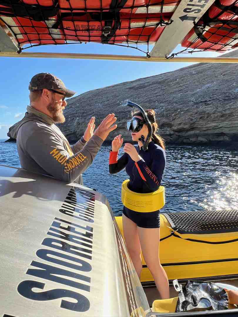 High-quality snorkel gear (mask, snorkel, fins, flotation belt) on a Maui beach towel - Learn to snorkel Maui