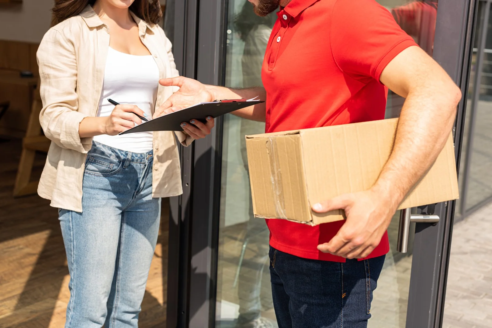 Doma Shipping professional logistics workers in red uniforms preparing international shipments in Chicago Doma Shipping professional logistics workers in red uniforms preparing international shipments in Chicago