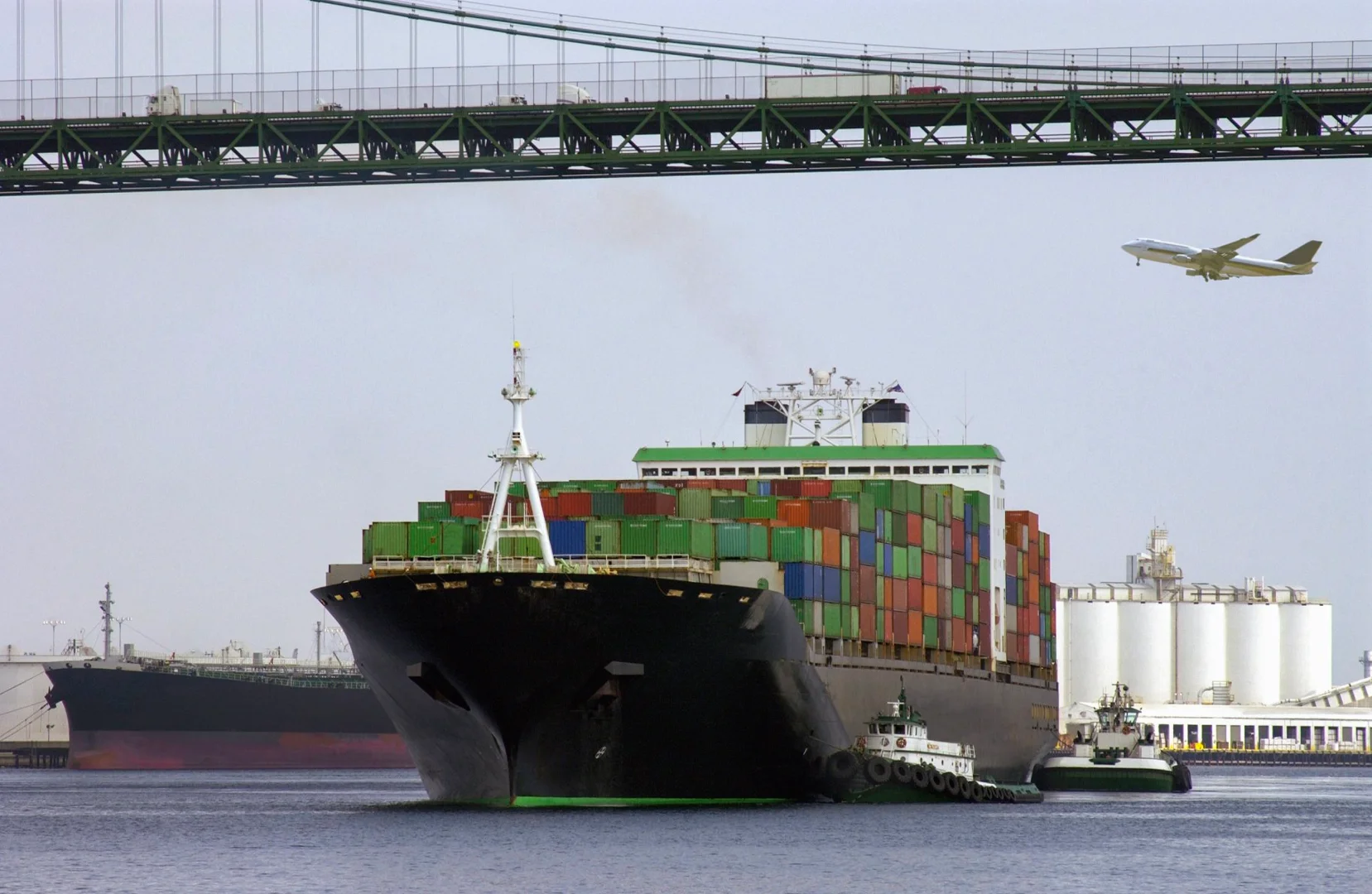 A cargo container ship at a logistics port preparing for transit to Europe, representing customs clearance A cargo container ship at a logistics port preparing for transit to Europe, representing customs clearance