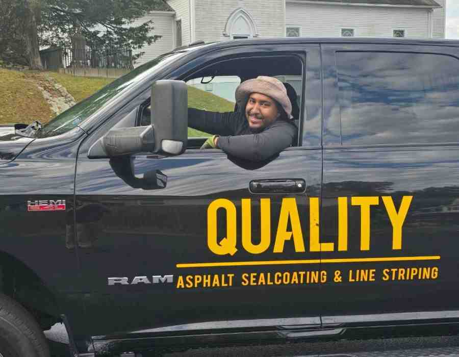 heavy truck on asphalt lot - asphalt maintenance cost