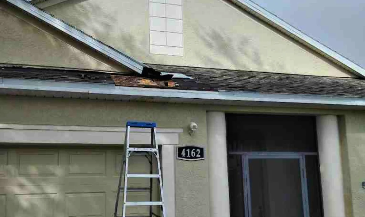 wind damaged shingles on a Melbourne FL home wind damaged shingles on a Melbourne FL home