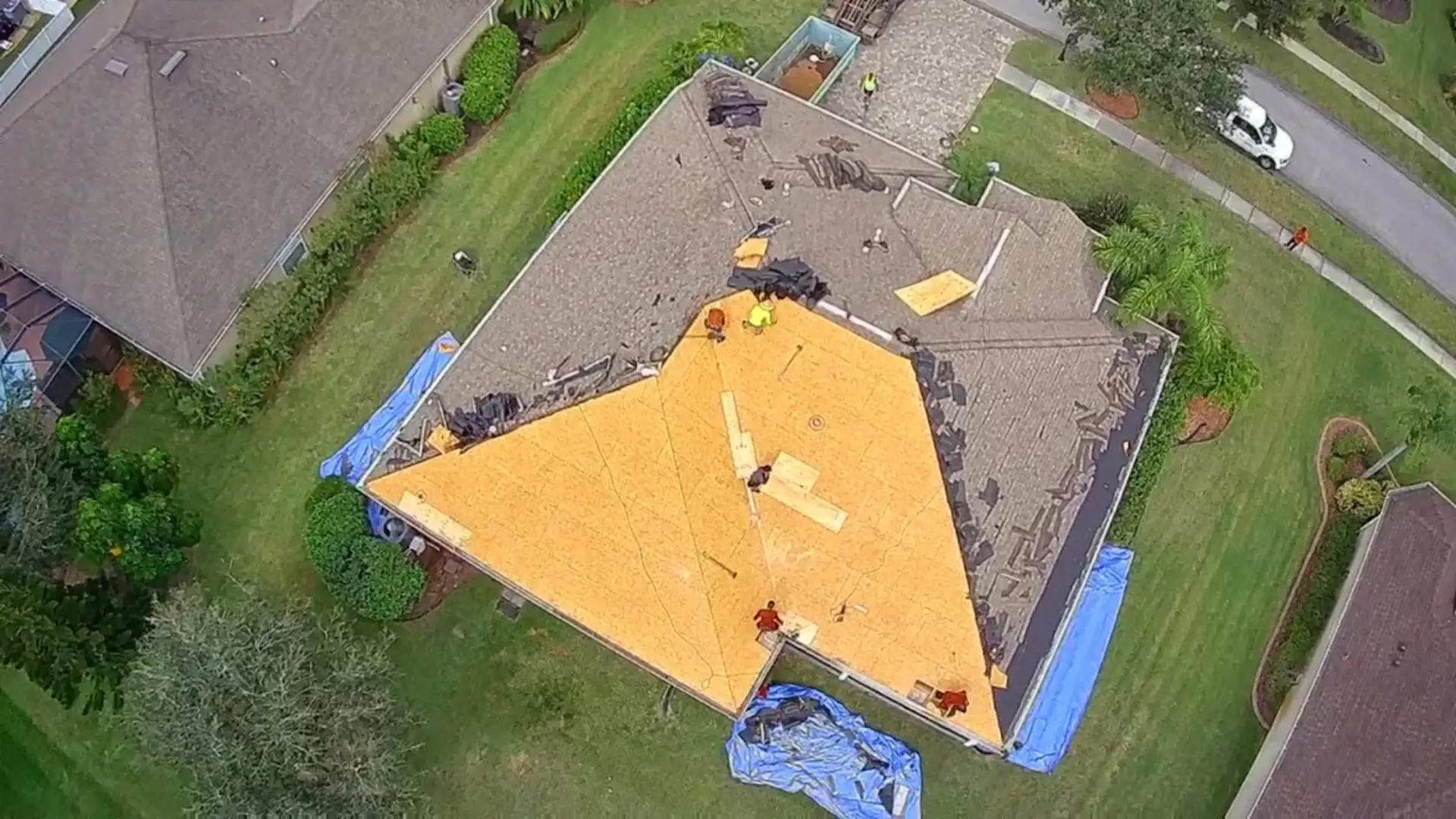 professional roof tarping on a home in Palm Bay FL