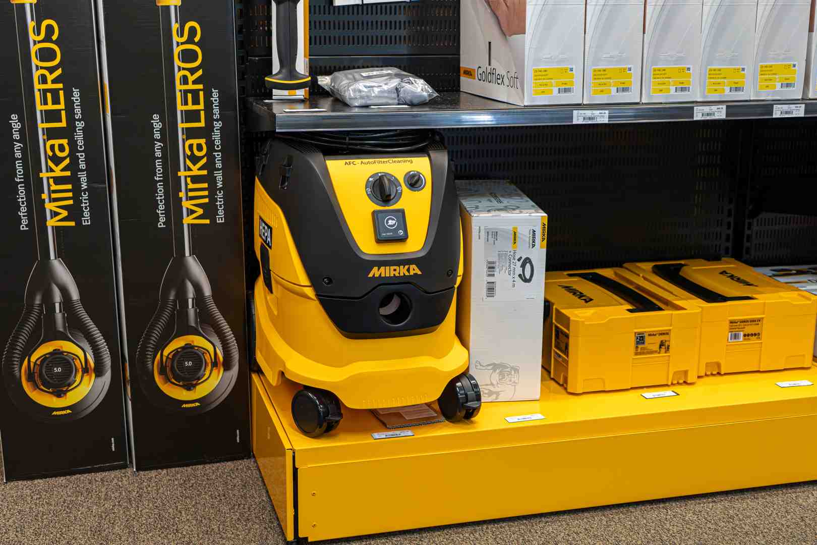 Collection of Mirka products: sanders, abrasives, and a dust extractor - Mirka