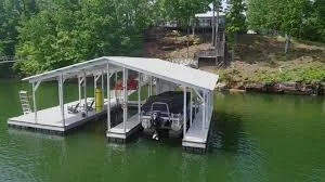 Private double-decker dock with a pontoon boat and a dog waiting to jump in - lake house rental smith lake Private double-decker dock with a pontoon boat and a dog waiting to jump in - lake house rental smith lake