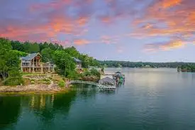 A happy family and their golden retriever relaxing on a private dock on Smith Lake A happy family and their golden retriever relaxing on a private dock on Smith Lake