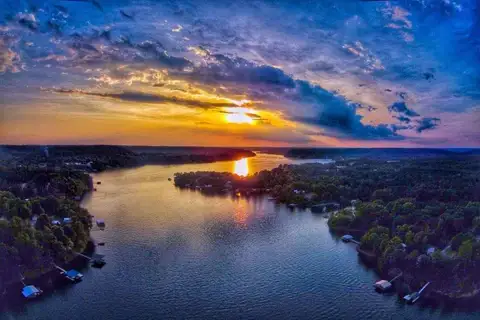 A stunning Smith Lake sunset viewed from a private dock of a lakefront home - Alabama lake house rentals