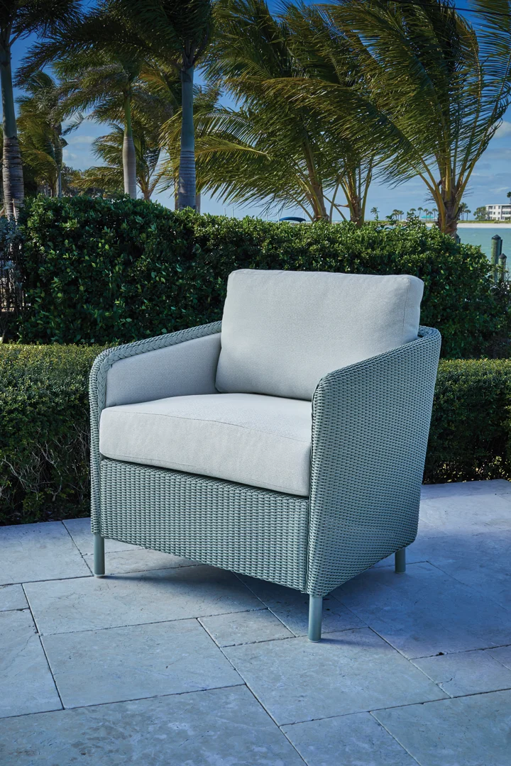 Weather-resistant outdoor cushions sitting beautifully inside a durable wicker frame Weather-resistant outdoor cushions sitting beautifully inside a durable wicker frame