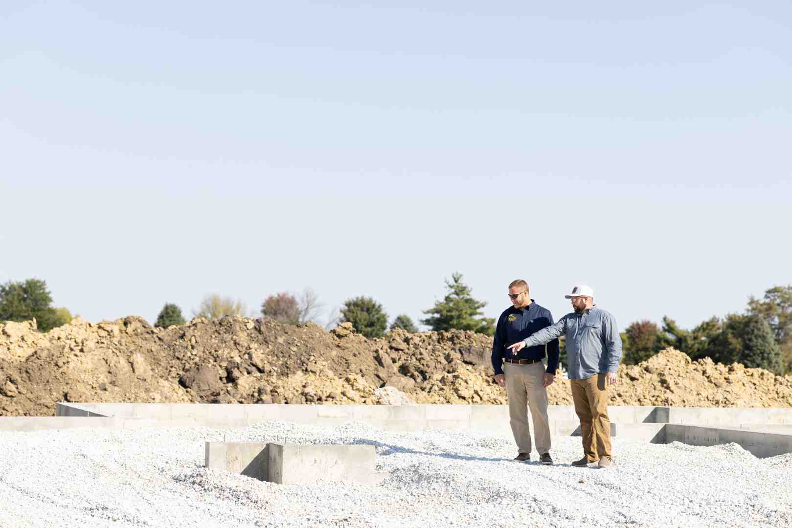 A professional land surveyor evaluating a rural Illinois lot for construction - houses built on your land