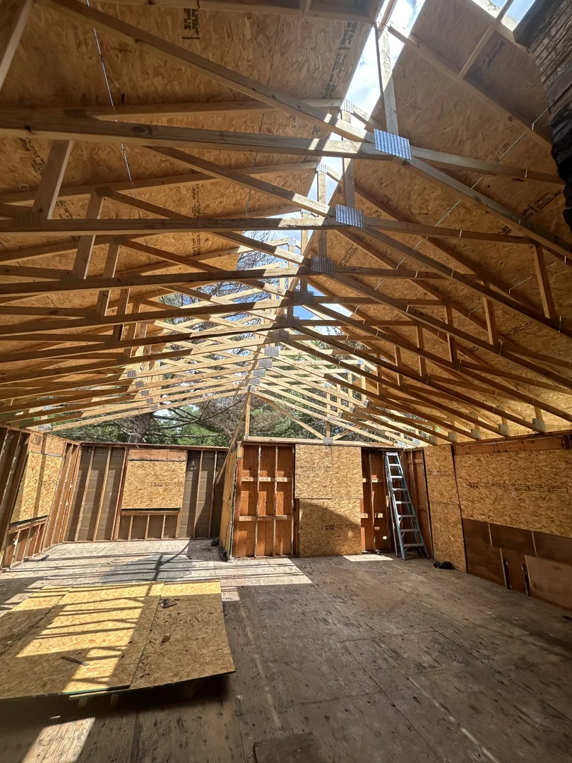 Framing phase of building a new house in Illinois with happy couple Framing phase of building a new house in Illinois with happy couple