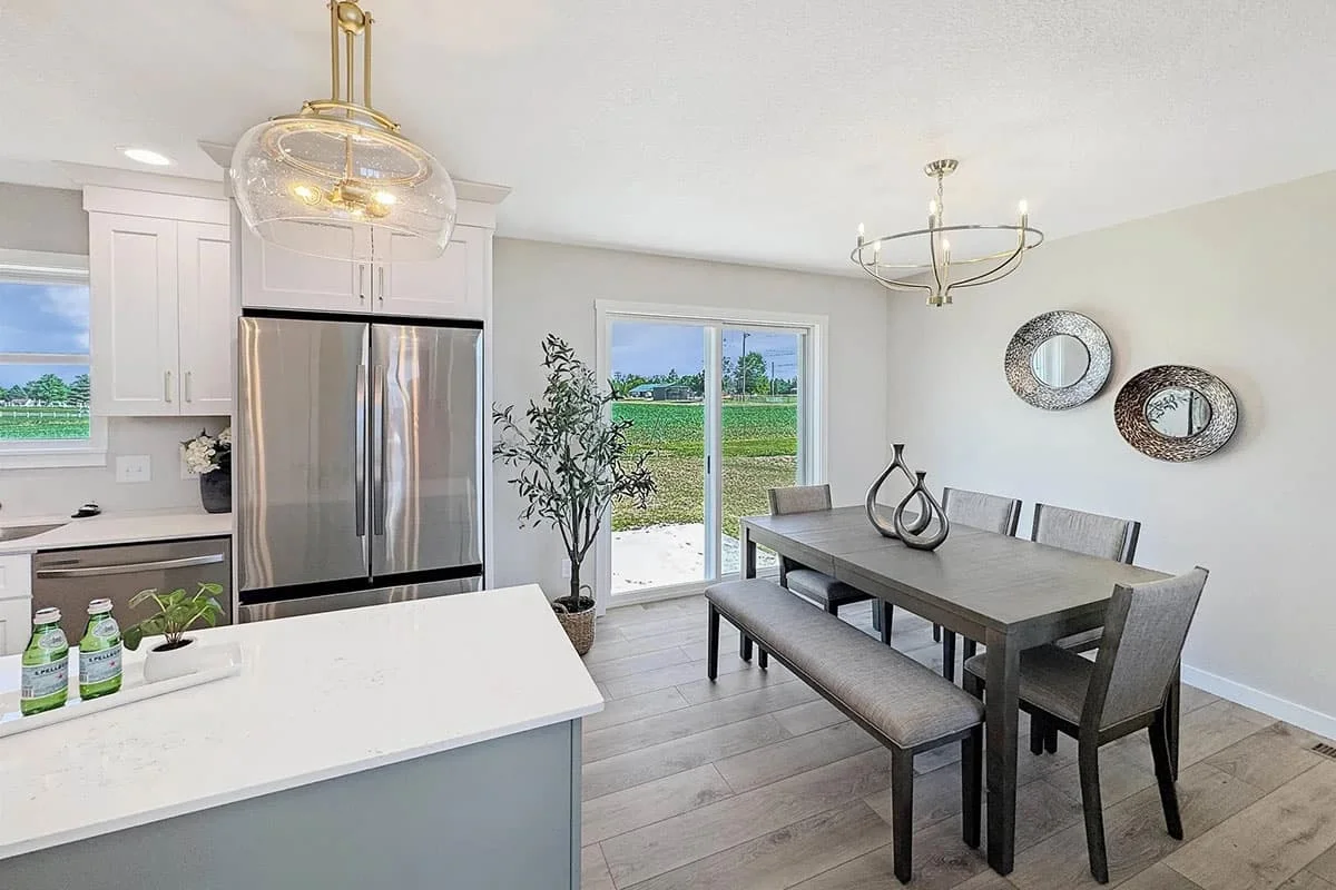 a happy man and woman standing in a modern kitchen design with high-end custom finishes and brand colors
