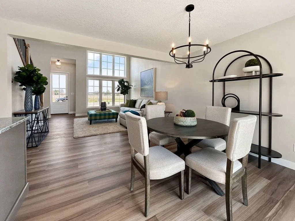 luxury foyer expansion in a renovated split-level home with a man and woman standing in the open space - Split level