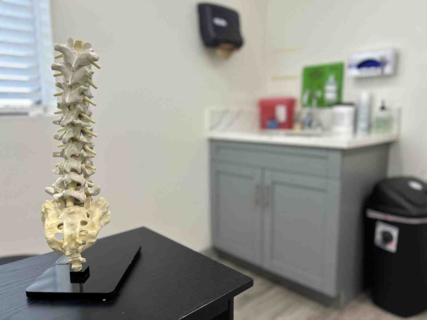 Diagram illustrating the location of the coccyx at the base of the spine - Coccydynia pain treatment