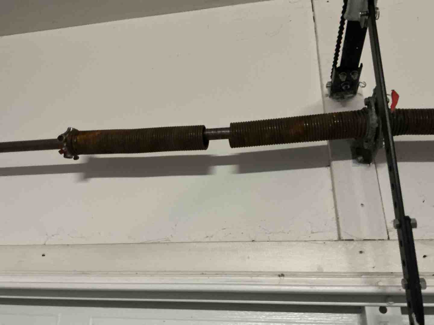Snapped torsion garage door spring requiring emergency repair - "My Garage Door Is Broken In Spanish Oaks, TX. Who Can I Call For An Emergency Repair?"
