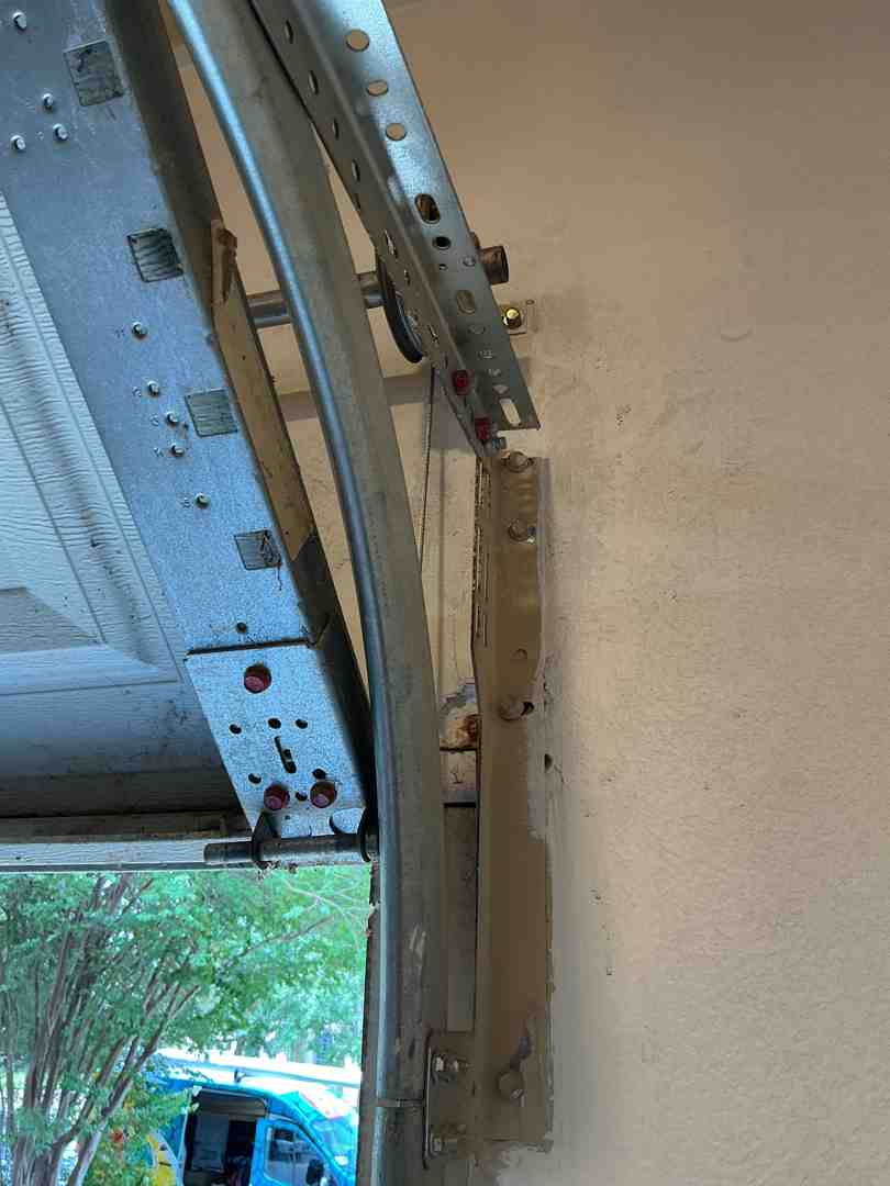 infographic showing common causes of off-track garage doors including vehicle impact, worn rollers, broken cables, bent tracks, and obstructions, with warning signs like crooked doors, grinding noises, gaps between rollers and tracks, and jerky movement - Fix Garage Door Off Track in Liberty Hill TX