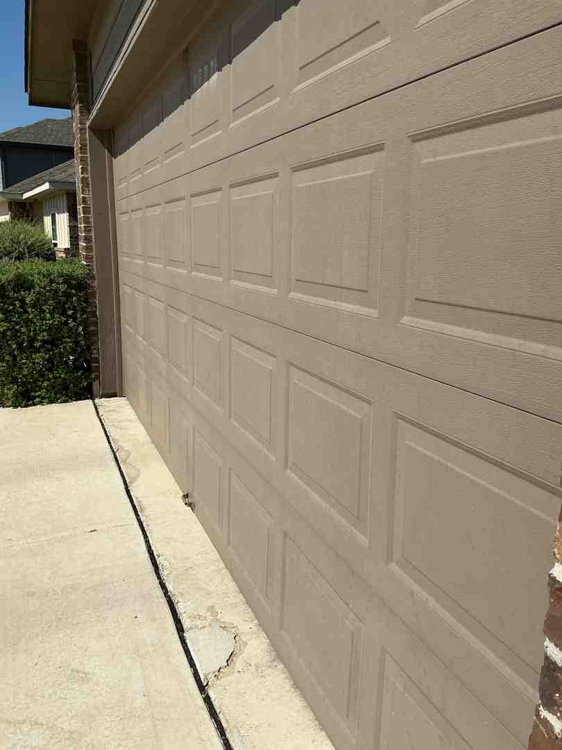Garage door with the sun shining on it - best garage door maintenance in cedar park tx