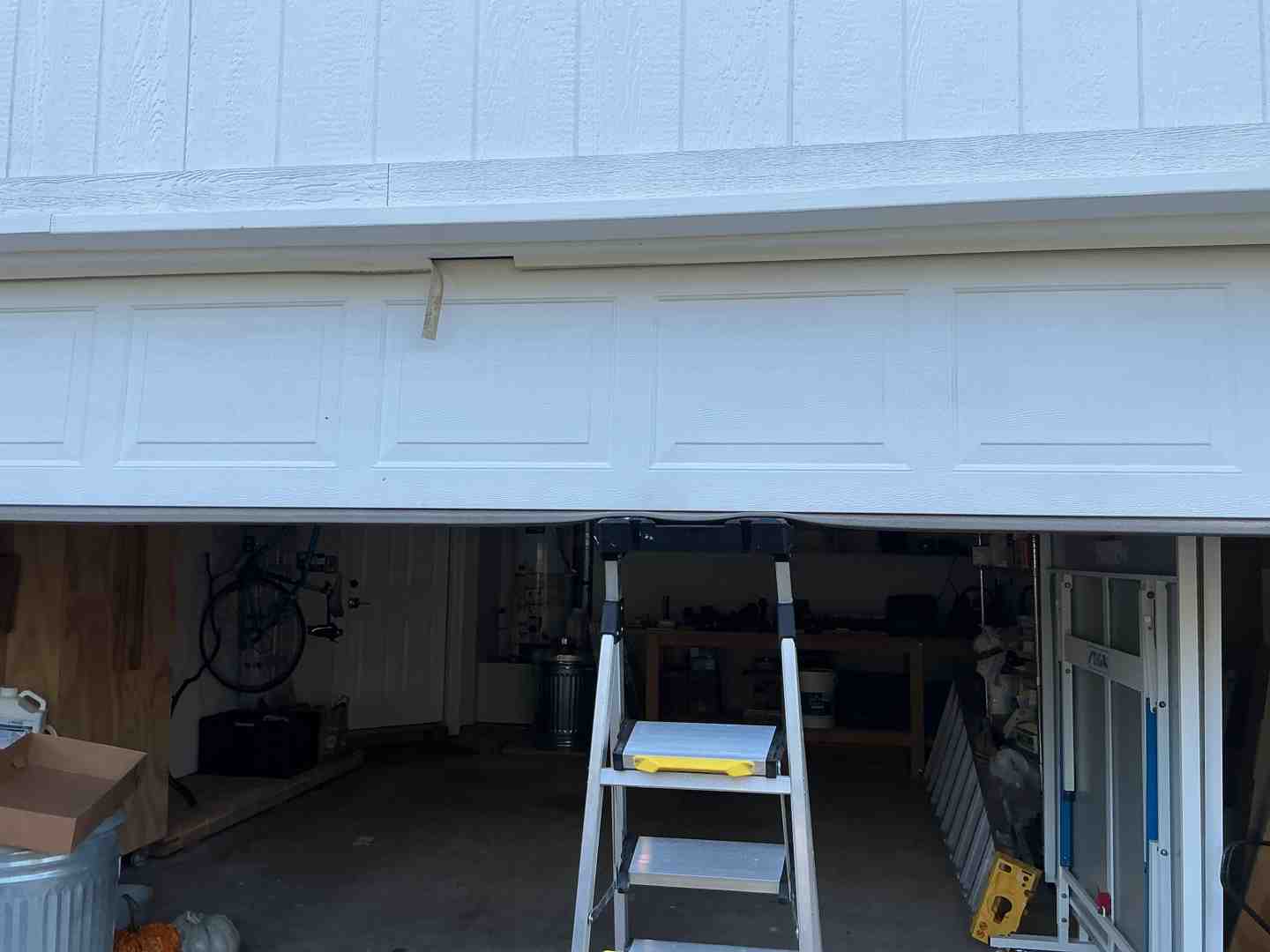 garage door making a loud noise or moving unevenly - Best Garage Door Maintenance in Liberty Hill TX