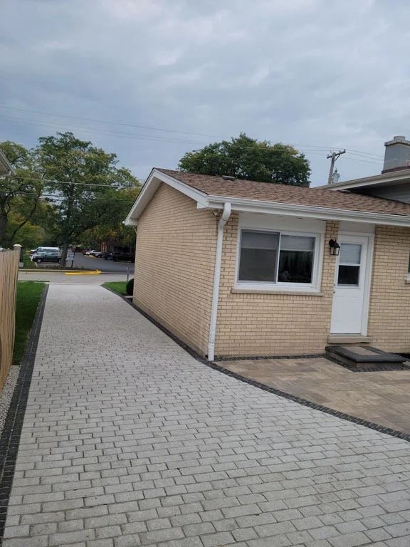 high-end clay brick driveway in a suburban Chicago setting - brick paving a driveway