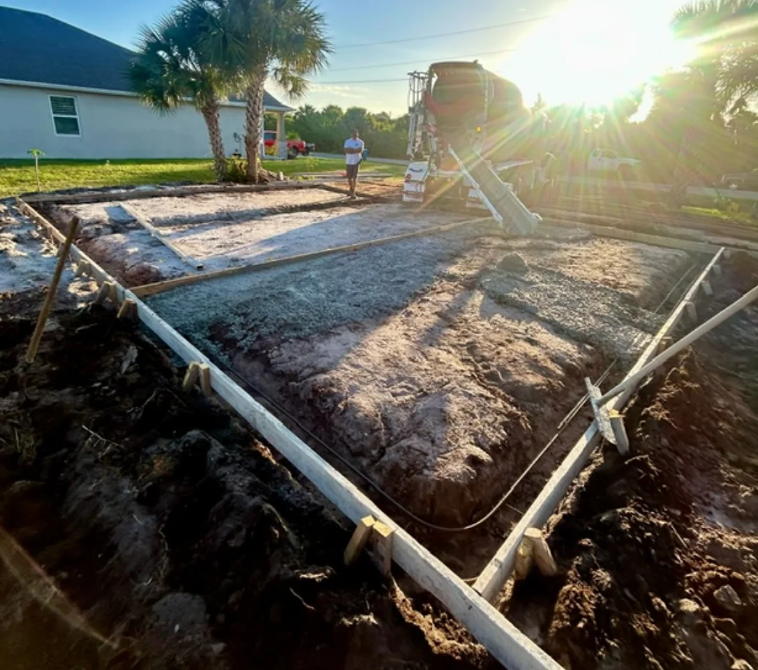 Fresh concrete being poured for a residential slab in Florida
