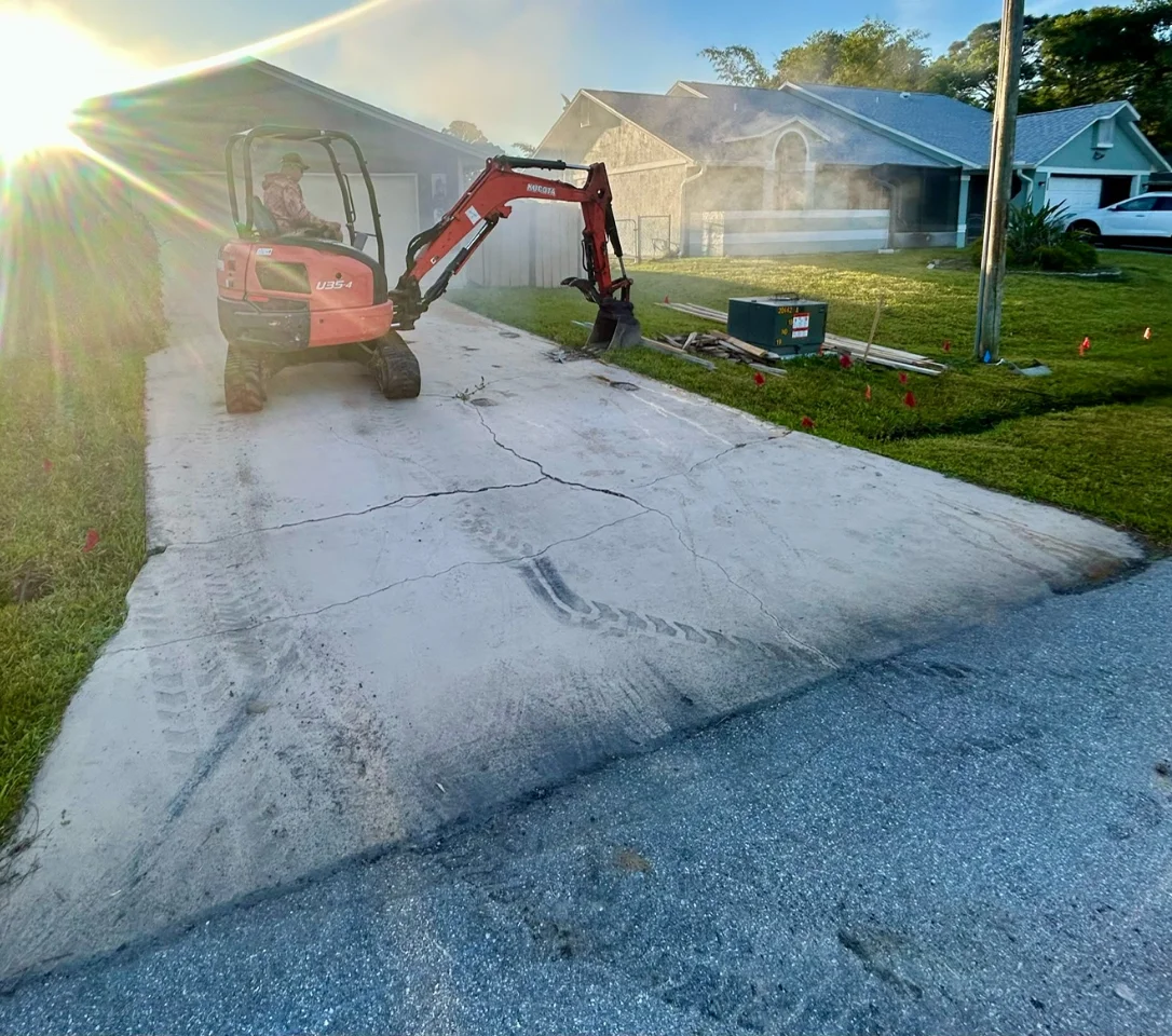 Excavation and base preparation for a new driveway in Brevard County