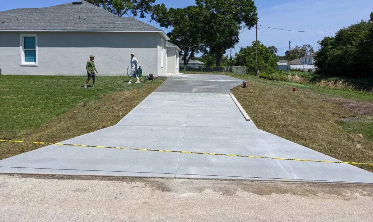 Concrete flatwork showing proper drainage and slope on a residential property