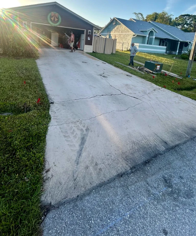deep spiderweb cracking in an old concrete driveway Melbourne FL