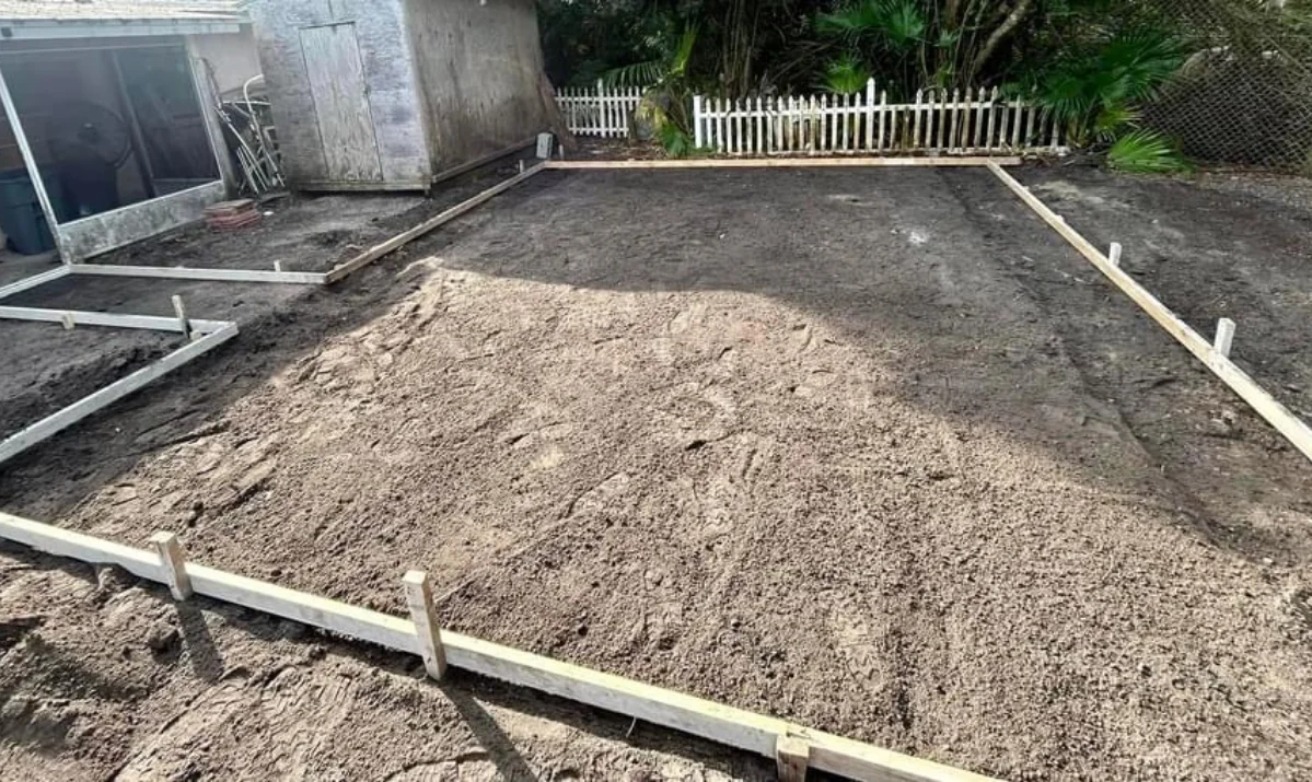 Preparing the base for a concrete patio with proper compaction and grading Preparing the base for a concrete patio with proper compaction and grading