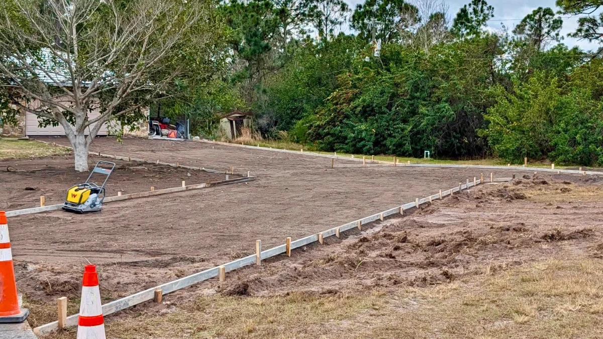 Site preparation, grading, and soil compaction for a durable concrete patio