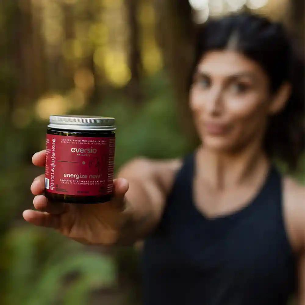 Eversio Wellness "Energize Now" supplement, providing clean energy without jitters, held by an active individual. Eversio Wellness "Energize Now" supplement, providing clean energy without jitters, held by an active individual.