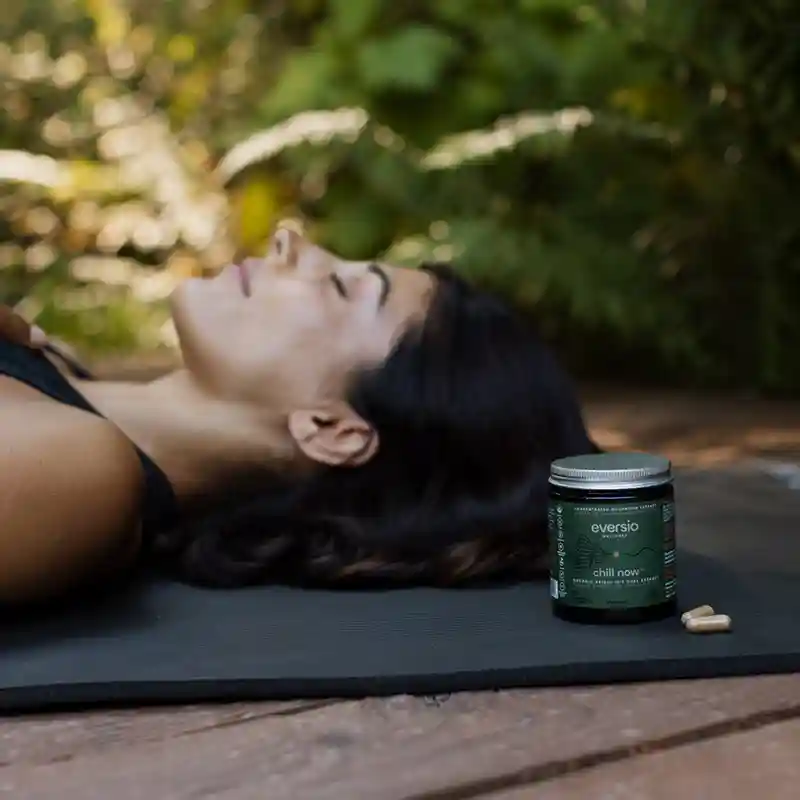 A woman meditating outdoors next to Eversio Wellness Reishi capsules, illustrating a holistic approach to regulate blood sugar naturally. A woman meditating outdoors next to Eversio Wellness Reishi capsules, illustrating a holistic approach to regulate blood sugar naturally.