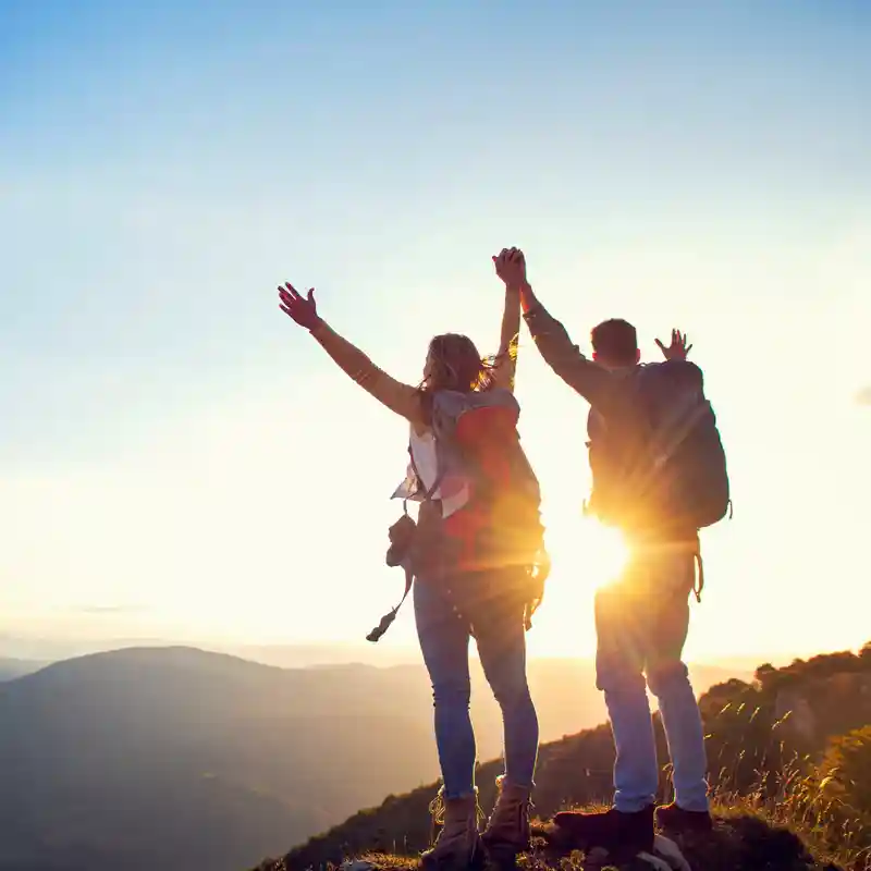Silhouette of two adventurers enjoying the fresh air and view, demonstrating the athletic benefits of Cordyceps for peak lung health - Cordyceps Lung Health Silhouette of two adventurers enjoying the fresh air and view, demonstrating the athletic benefits of Cordyceps for peak lung health - Cordyceps Lung Health