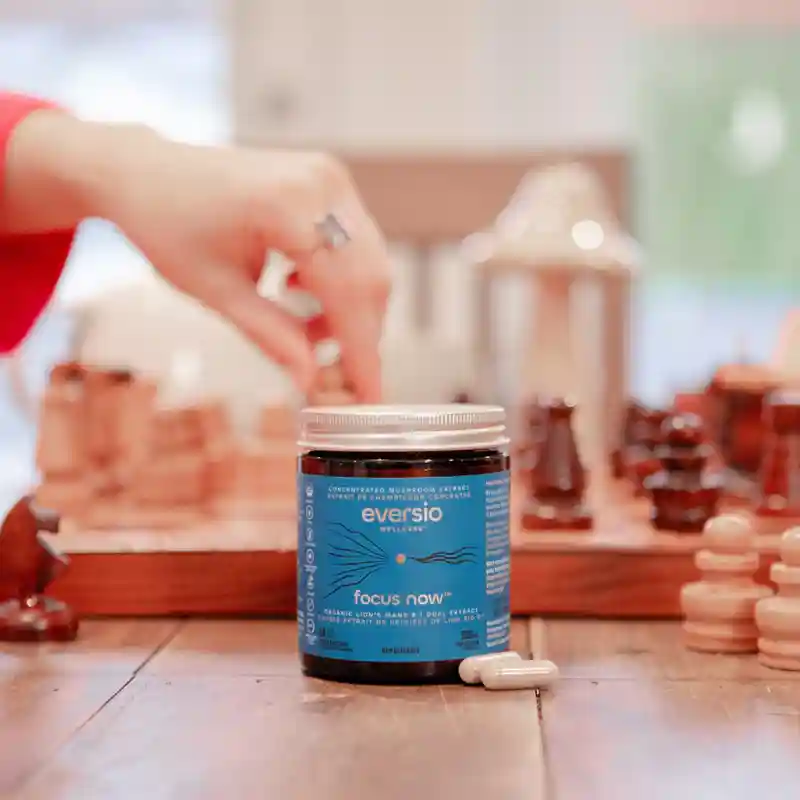 "Focus Now" Lion's Mane extract capsules on a chess board; symbolising mental clarity and concentration from the lion's mane mushroom pills benefits.