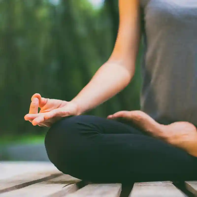 Woman in the lotus position meditating outdoors; stress reduction provides a crucial, holistic daily immune boost. Woman in the lotus position meditating outdoors; stress reduction provides a crucial, holistic daily immune boost.