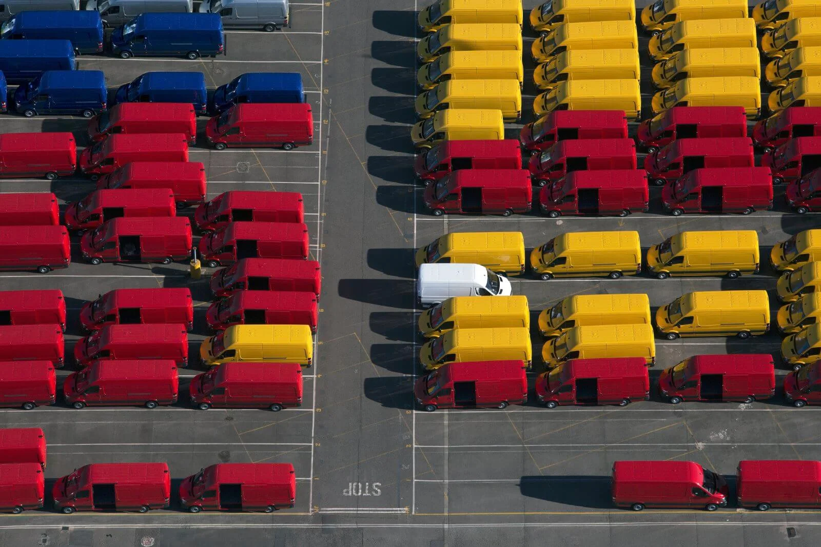A courier truck dispatching from a major warehouse hub A courier truck dispatching from a major warehouse hub