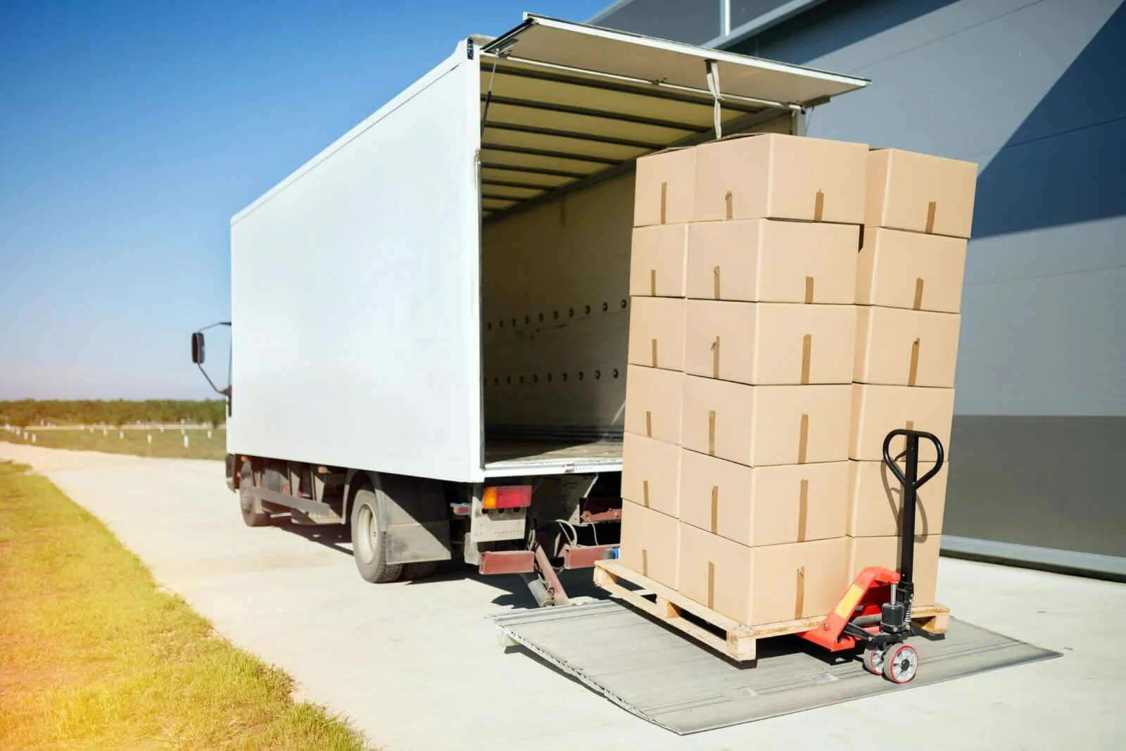 Warehouse dispatch center showing high-priority freight handling - expedited shipping Warehouse dispatch center showing high-priority freight handling - expedited shipping