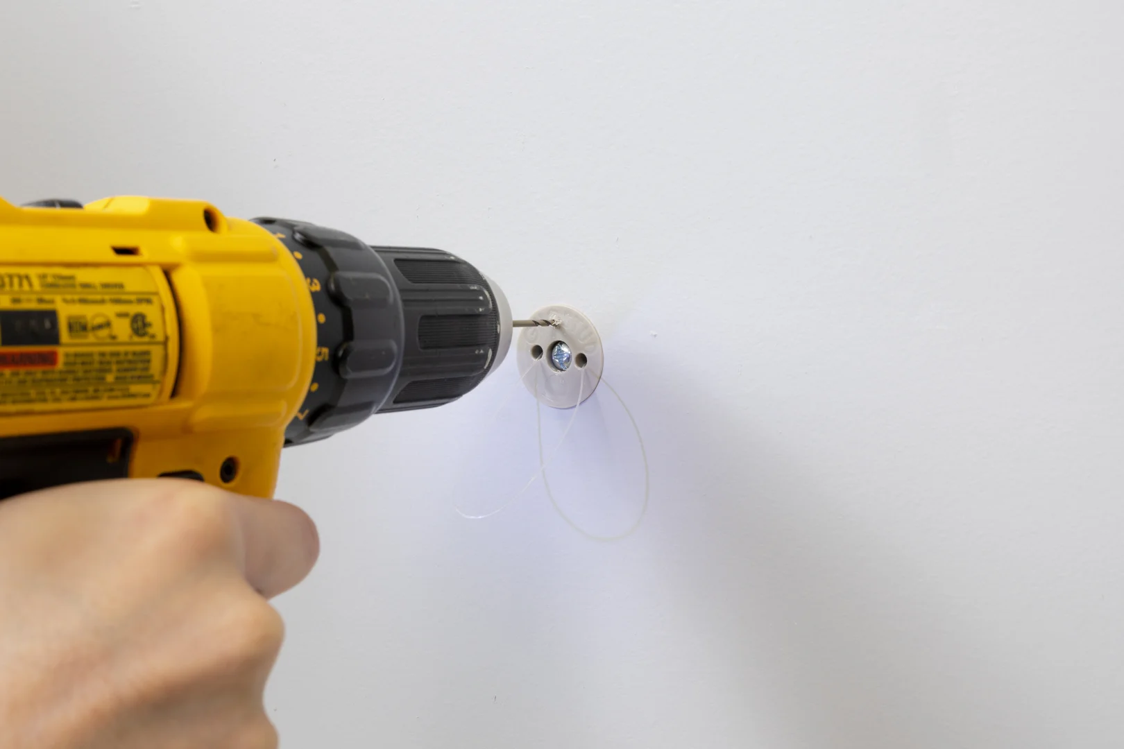 drilling pilot holes and seating heavy-duty wall fixings
