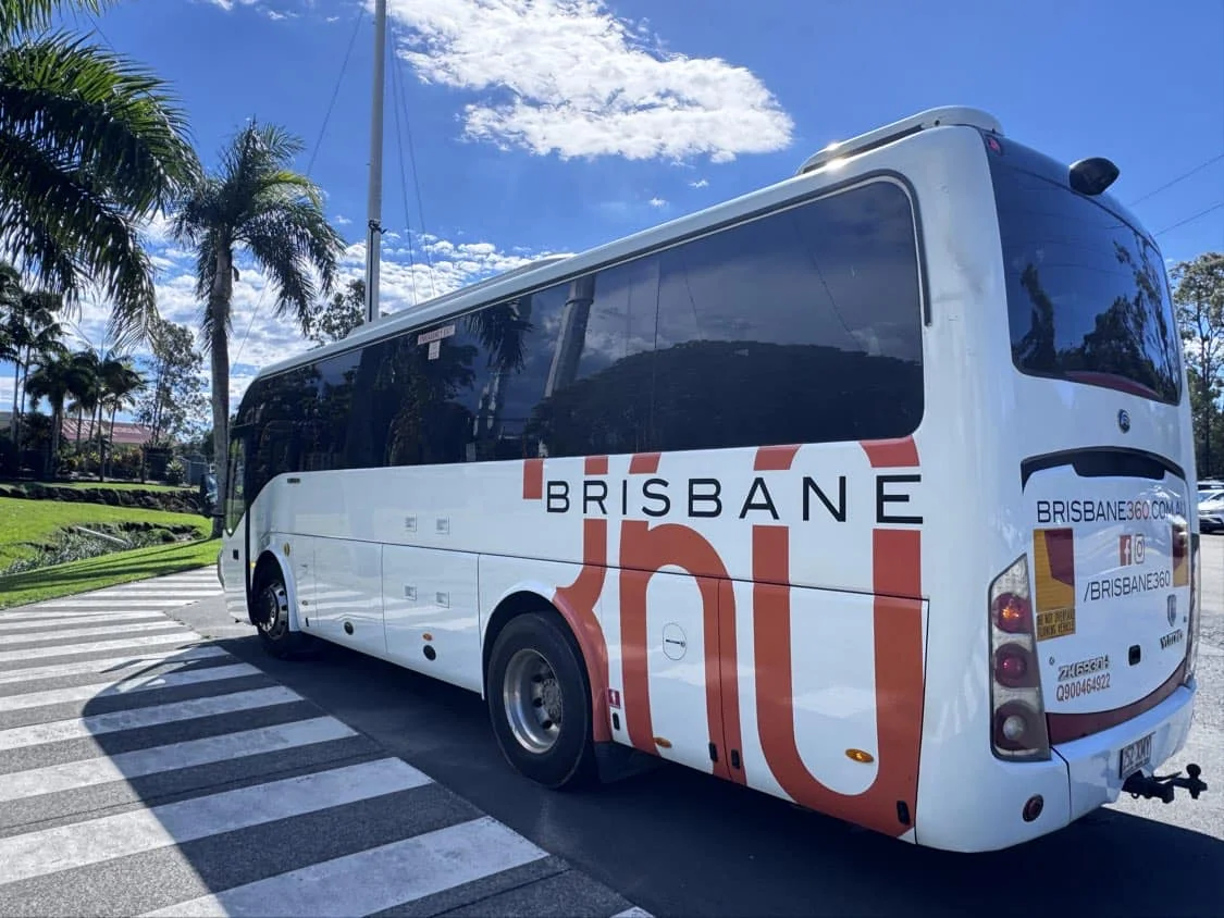 Students relaxing onboard a modern Brisbane360 coach for a study tour excursion across Queensland