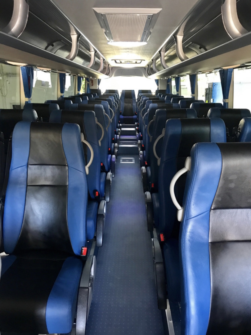 luxury bus interior with leather seating - luxury tour bus hire