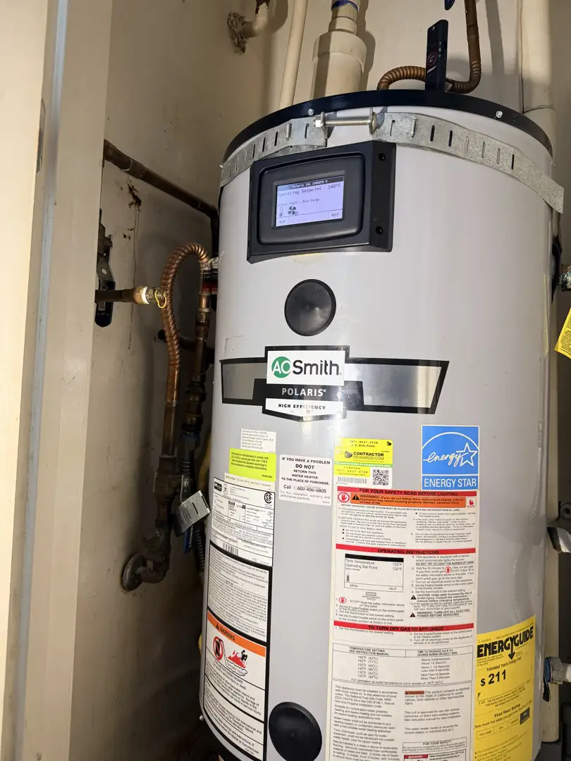 homeowner inspecting digital display on a modern tankless water heater - tankless hot water heater repair homeowner inspecting digital display on a modern tankless water heater - tankless hot water heater repair