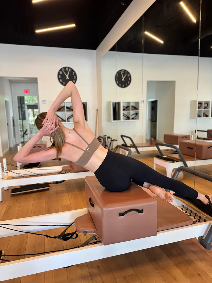 pilates reformer machine in a studio setting - pilates for abs and waistline pilates reformer machine in a studio setting - pilates for abs and waistline