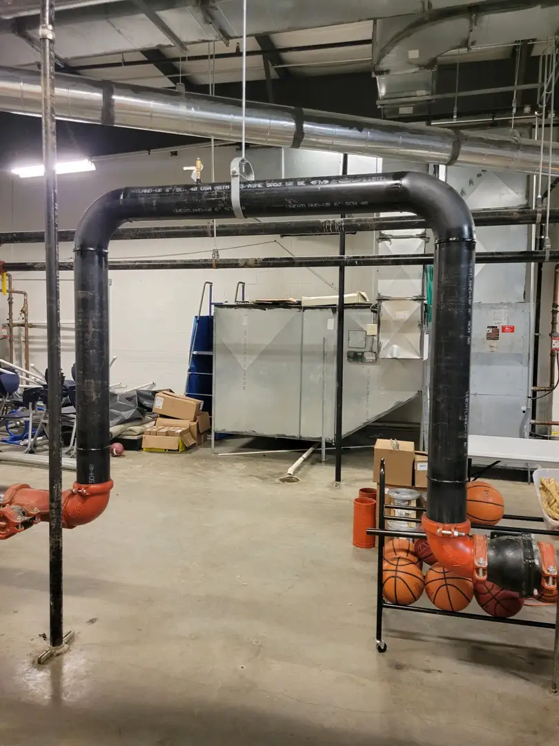 commercial mechanical room with HVAC and electrical systems