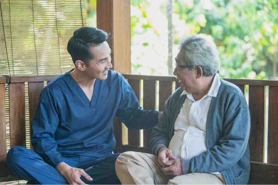 Caregiver engaging with senior in a home setting