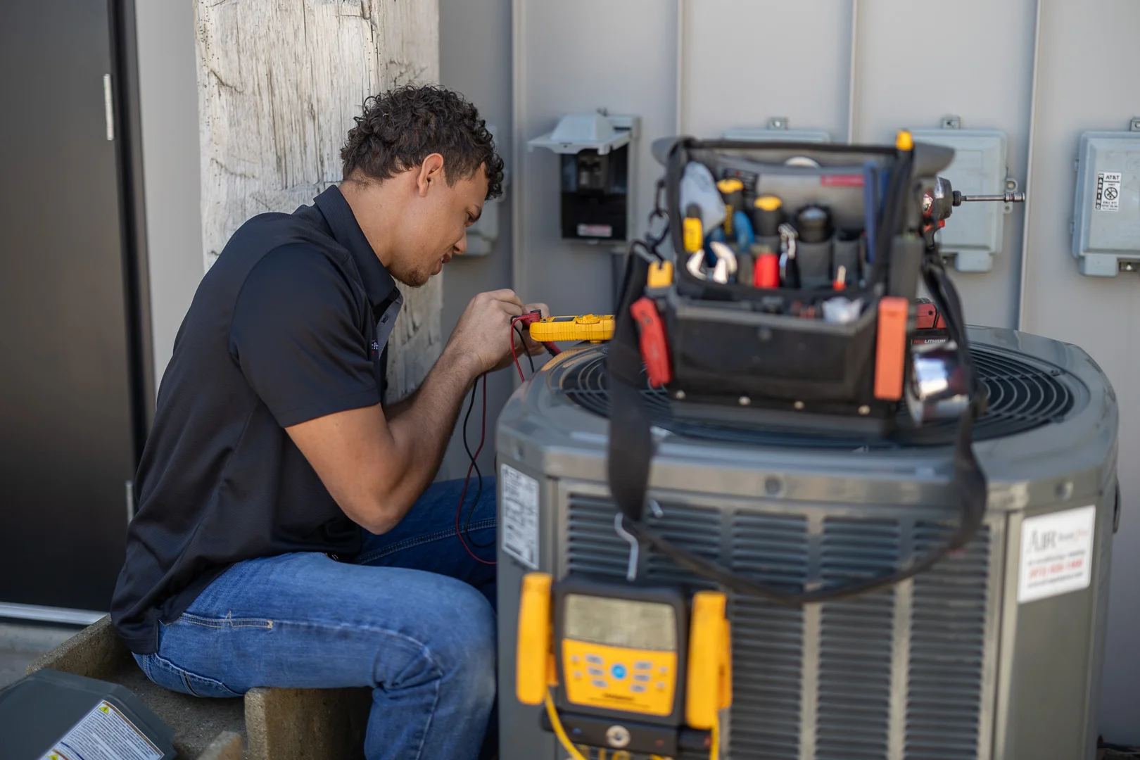 Technician measuring static pressure across a residential duct system
