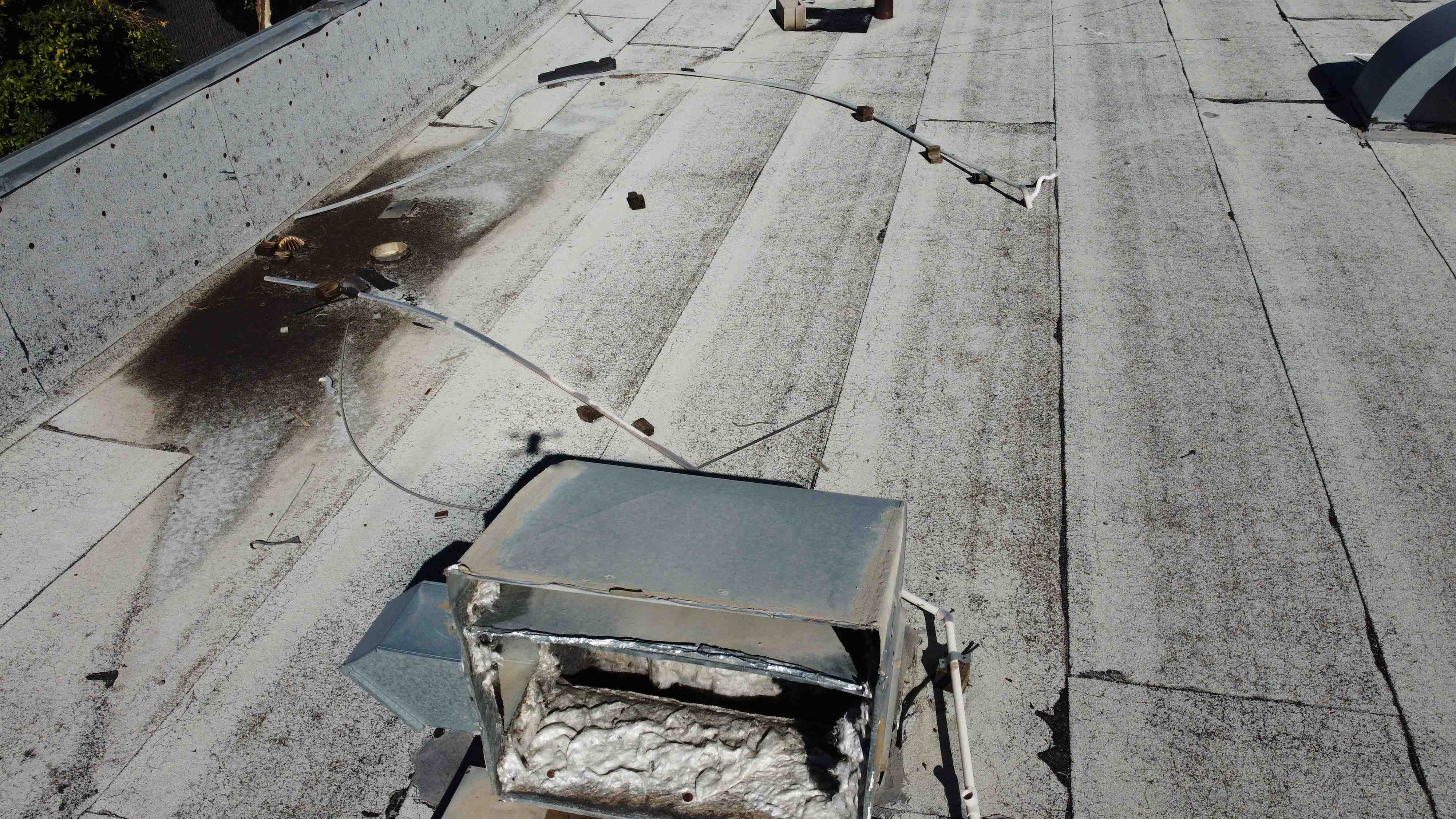 Water pooling can lead to structural damage - Signs your apartment complex needs a new roof