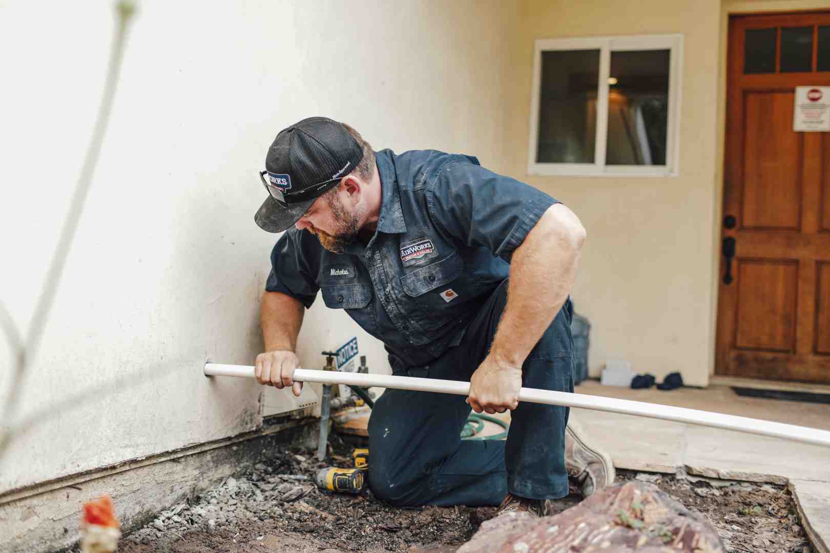 professional technician inspecting home utility systems