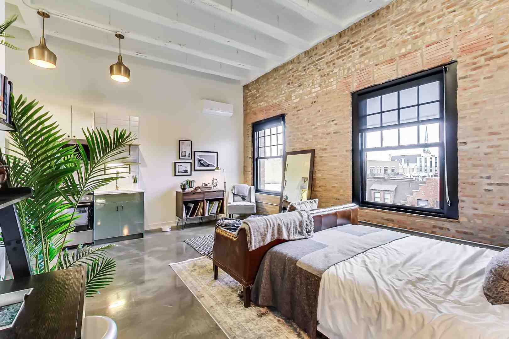 A stylish, modern apartment interior with large windows - Chicago West Loop properties