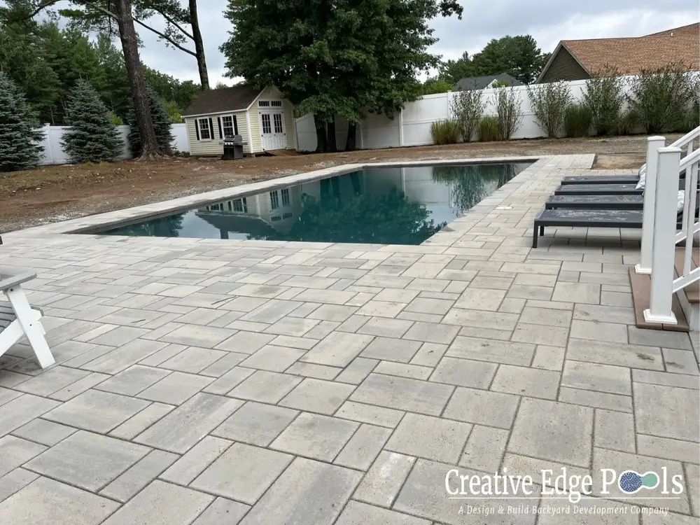 completed backyard pool and patio installation