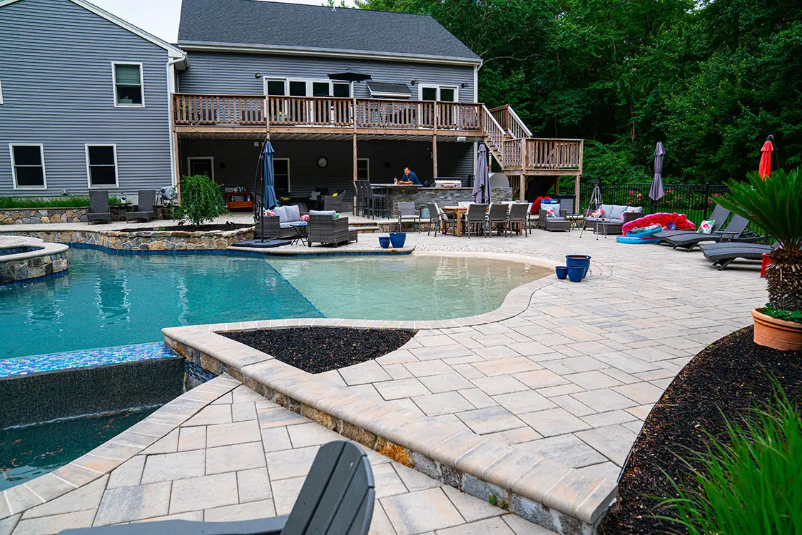 multi-level timber deck with separate zones for lounging and swimming - deck ideas with pool